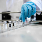 Single Blood Test Finds 50 Hidden Cancers A healthcare professional in a lab preparing vaccine vials