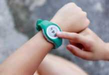 Walking Myth Busted: 10,000 Steps Not Needed Person using a fitness tracker on their wrist