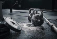 Avoid Injury: The Right Way to Bench Press Kettlebells and weights on a gym floor with chalk dust