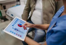 Scalp Mistakes That Speed Up Hair Loss Nurse showing a patient health data on a tablet