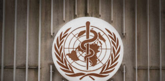 World Health Organization emblem featuring a globe and caduceus