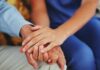 Scary Handshake-Depression Link Emerges An elderly persons hand being held by a younger persons hand, symbolizing care and support