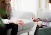 Four Essential Habits for Emotional Regulation Two individuals engaged in a counseling session, one taking notes