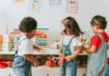 Are You Emotionally Smarter Than a Five-Year-Old? Three children engaged in play with educational toys in a colorful classroom