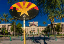 Summer Heat Adaptation: Phoenix Heat Hack Hides in Plain Sight Colorful sign of the Phoenix Pride Commission in front of a government building