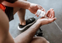 Person pouring probiotic pills into their hand