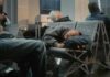 Why Sleep Duration and Regularity Work Together Passengers sleeping on airport benches with luggage nearby