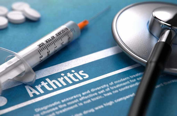 334478441 Syringe and stethoscope on arthritis document