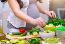 Carb Shock: One Swap Tied To Longer Health Person preparing a fresh salad with green vegetables in a kitchen