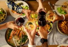 MRI Finds ‘Moderate Drinking’s’ Brain Damage Hands clinking wine glasses over a dinner table