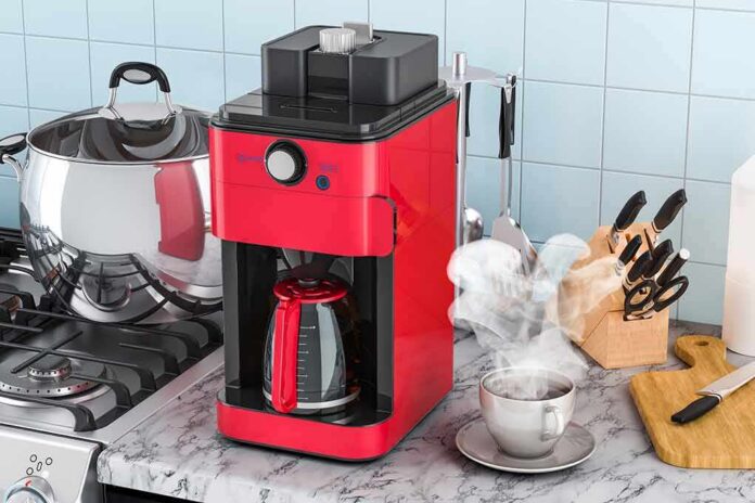Red drip coffee maker on a kitchen counter