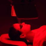 Person receiving red light therapy