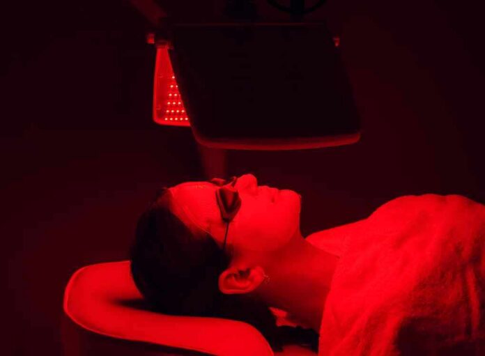 shutterstock_1849141942 Person receiving red light therapy