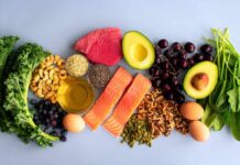 Metabolic Syndrome Prevention: Vegetables vs. Fruits An assortment of healthy foods including fish, nuts, fruits, and vegetables arranged on a light background