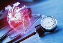 Mouth Germs Hardening Heart Valves An anatomical heart illustration next to a blood pressure monitor