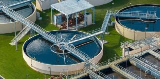 Wastewater treatment plant with circular clarifiers and aeration tanks
