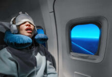 Massive study turns snoring into a brain warning A passenger sleeping on an airplane with headphones and an eye mask