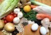 Foods That Help Hair Growth Assorted fresh foods including vegetables, grains, eggs, fish, and chicken