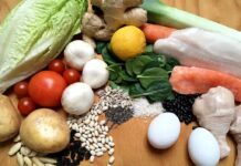 Assorted fresh foods including vegetables, grains, eggs, fish, and chicken
