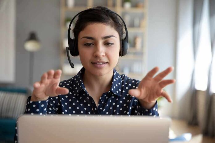 Woman wearing headset on video call
