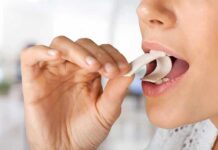 Virus-Killing Chewing Gum Stuns Scientists Person placing a piece of chewing gum in their mouth