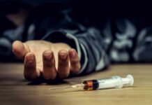 Diabetes Shot Stuns Heart Doctors Syringe on table near an outstretched hand