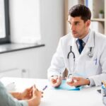 Doctor explaining glucose meters to a patient