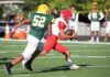 NFL Icon’s Haunting Alzheimer’s Battle Football player in red runs with the ball as defender in green attempts a tackle