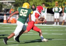 NFL Icon’s Haunting Alzheimer’s Battle Football player in red runs with the ball as defender in green attempts a tackle