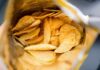 Ridged potato chips inside an open bag