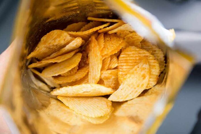 Ridged potato chips inside an open bag