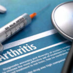 Cheap Fiber Stuns Arthritis Pain Syringe and stethoscope on arthritis document