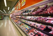 Deli Meat Cancer Link Sparks Industry Panic Grocery store meat aisle stocked with packaged beef and poultry