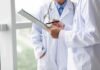 Benefits of Prescribing Food As Medicine Doctors reviewing a clipboard
