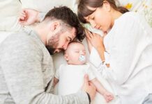 Hidden Crisis: Post‑Baby Dad Deaths Parents sleeping beside newborn baby