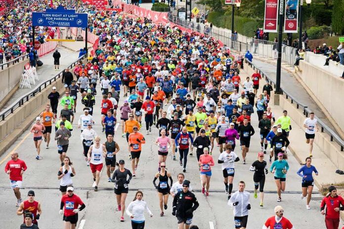 shutterstock_129635579 Steffi Jones, Zhang Zhongqi, Andreas Hestler, Christin Priebst, Colin David Jones, and Chuck Howley among marathon runners