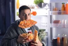 After-Dinner Nibble, Lasting Harm man in robe eating pizza at open refrigerator