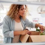 Fast Food Hangover Tied To Darker Minds Woman unpacking groceries into a refrigerator