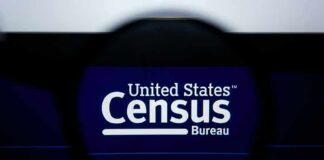 Magnifying glass over United States Census Bureau website