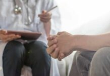 Fatty Liver: How to Fix It Without Pills & Procedures Patient clasping hands during consultation with a doctor