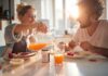Scientists Explain Why People Respond Differently to the Same Diet Couple eating breakfast with orange juice at a sunlit table