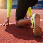 sprinter at starting blocks on track