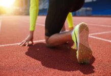 Body and Brain Benefits of Sprinting sprinter at starting blocks on track