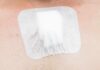 adhesive bandage on chest