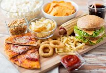 Spicy Meals, Crohn’s: Disturbing Pattern Assorted fast food on a wooden board