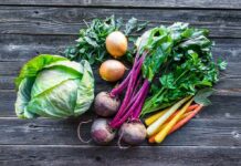 Assorted fresh vegetables on wooden table
