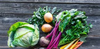 Assorted fresh vegetables on wooden table