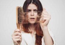 Weight-Melt Trend, Hair Fallout Woman holding a hairbrush with clumps of hair