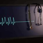 Best Foods to Protect Against Common Heart Problem stethoscope hanging on monitor with flatlined ecg