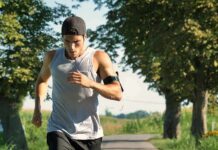 Man running on a tree-lined path